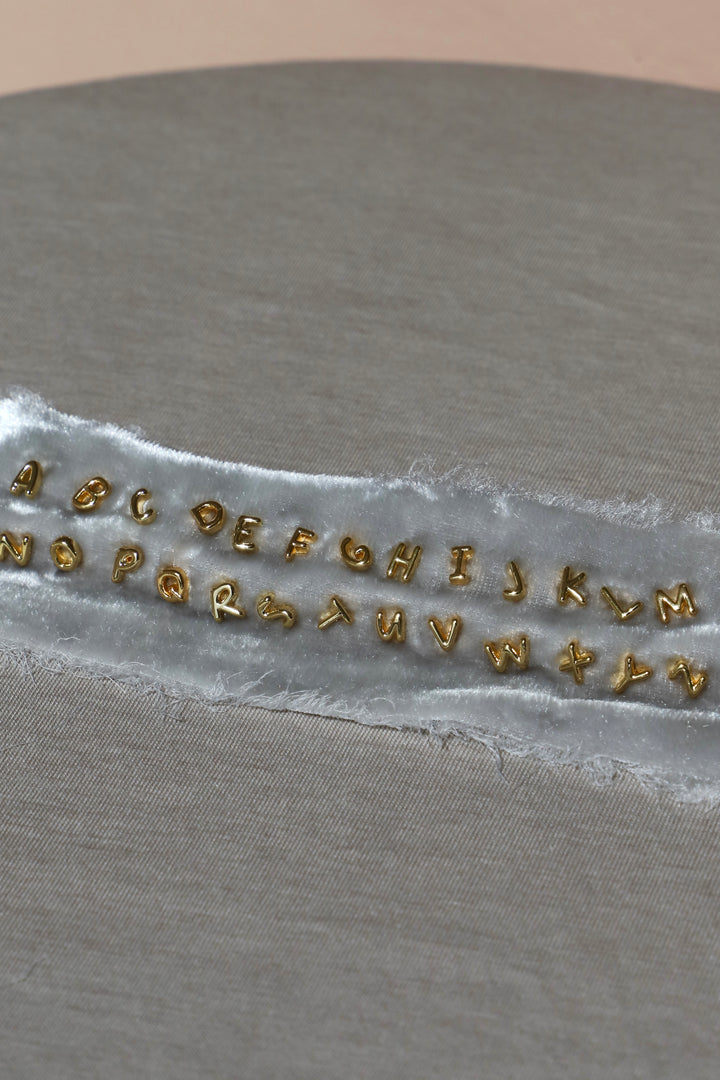 TINY GOLD INITIAL STUD