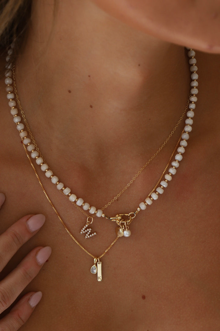 PEARL INITIAL CHARM