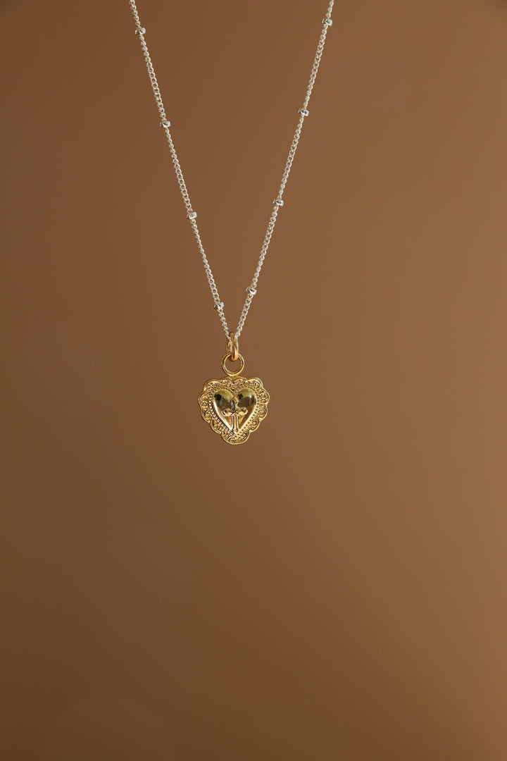 VINTAGE HEART AND CROSS CHARM