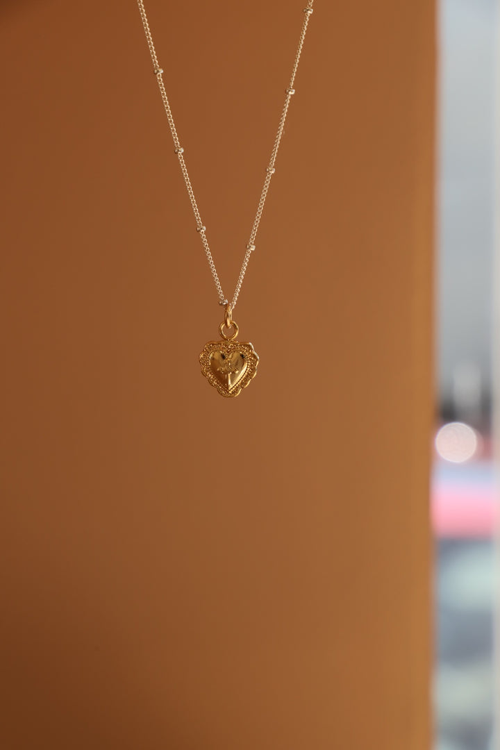 VINTAGE HEART AND CROSS CHARM